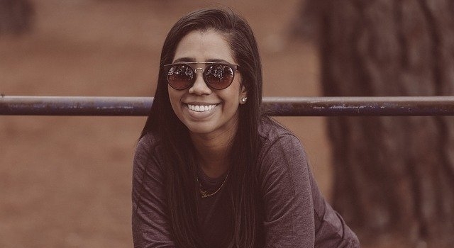 happy woman wearing sunglasses 640.jpg